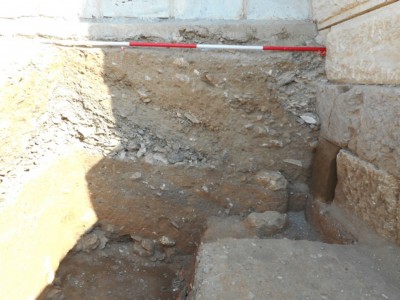 Figure 6. Operation 2 showing several phases of the infilling of the fortification wall; at the lowest level on the left side, the disturbed Classical- or Archaic-period grave was excavated.